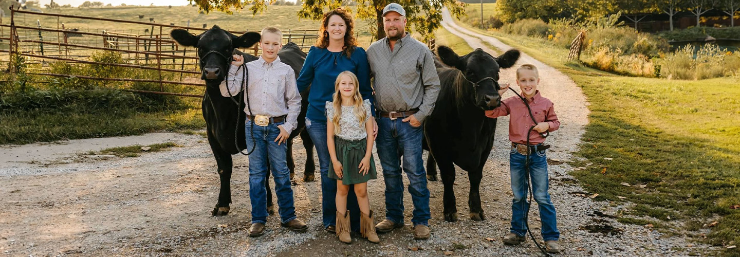 A Missouri State Fair Foundation Member Family Posing with their cattle