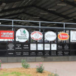 The sponsor wall outside of the MFA Youth Livestock Arena